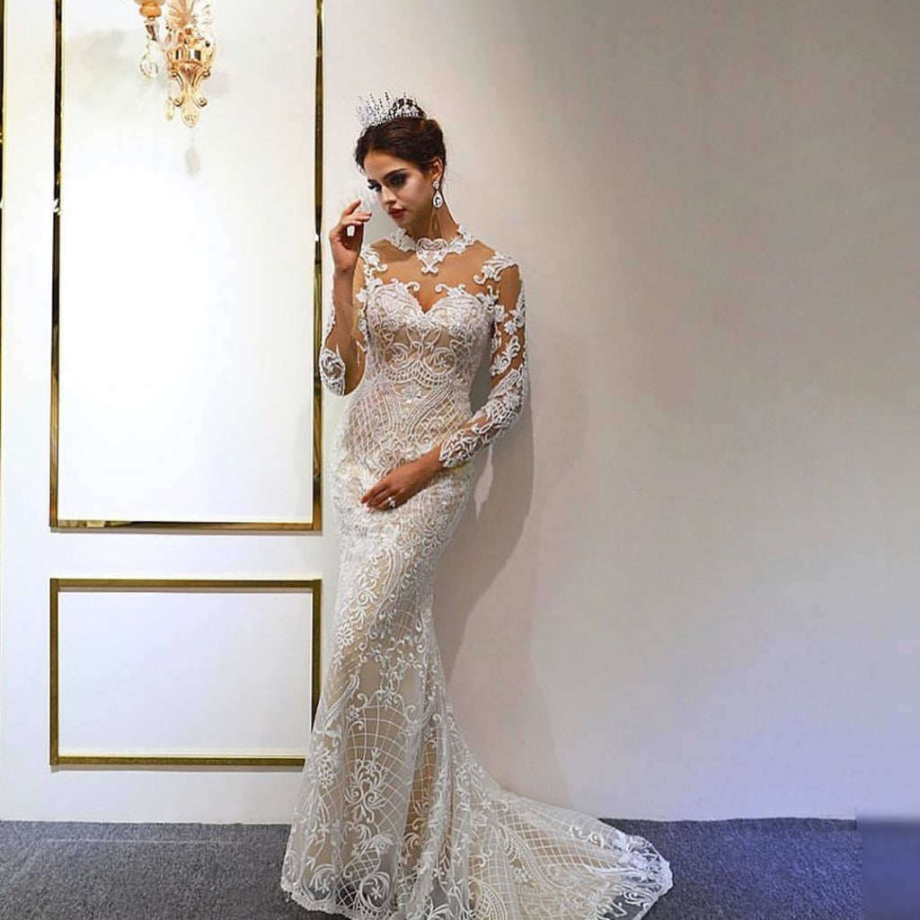 Precioso vestido de novia largo de corte A, escote corazón, apliques de encaje y mangas con mangas.