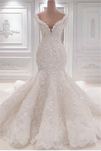 Precioso vestido de novia largo de sirena con escote en V, apliques, encaje y volantes
