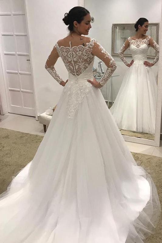 Magnifique robe de mariée en tulle et dentelle, coupe trapèze, manches longues