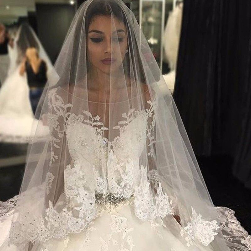 Precioso vestido de novia con apliques de tul, escote redondo, mangas largas y cristales