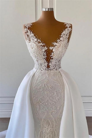Precioso vestido de novia de corte A sin mangas con escote en V y cola desmontable