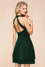 Robe de bal dos nu mi-longue sans manches en soie vert foncé brillante