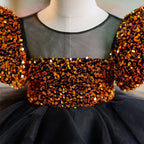 Vestido negro de lentejuelas doradas para bebé niña en su primer cumpleaños 