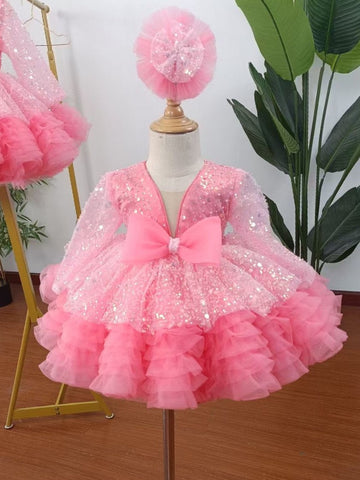 Vestido de bebé niña color lila con lentejuelas, mangas largas con volantes y lazo hasta la rodilla 
