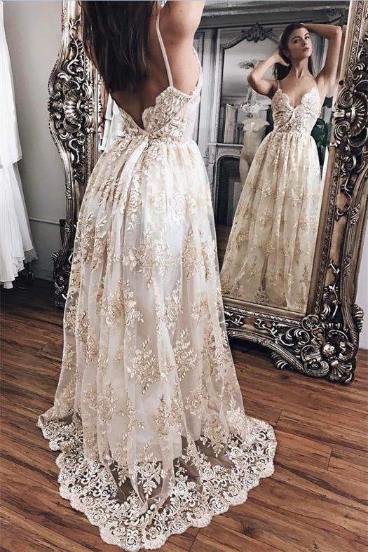 Vestido de fiesta elegante con apliques de encaje, escote en V, espalda descubierta y sin mangas.
