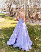 Vestido de fiesta de organza con tirantes finos y corte en A