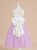Vestido midi de encaje floral y lazo grande 