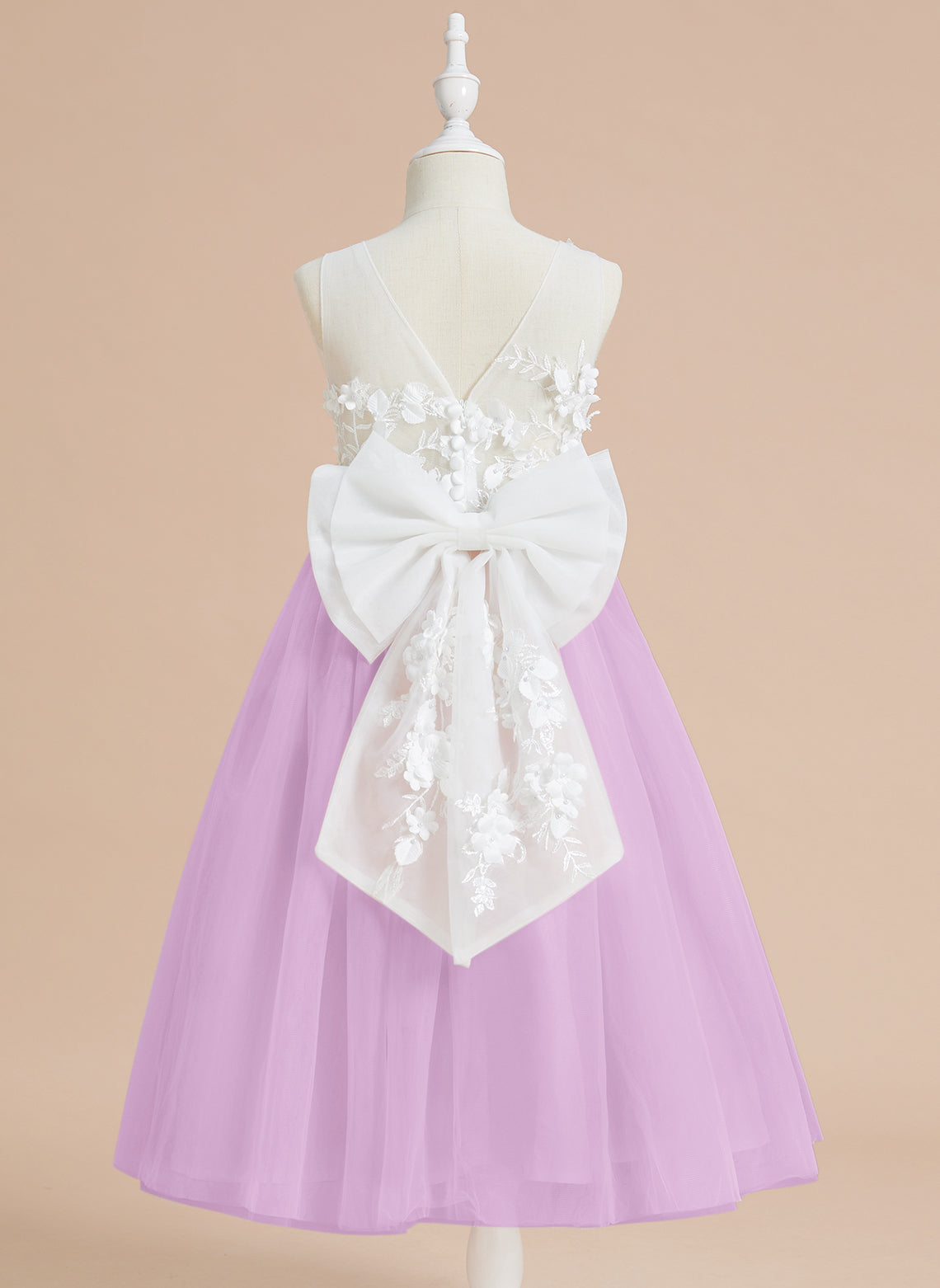 Vestido midi de encaje floral y lazo grande 