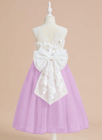 Vestido midi de encaje floral y lazo grande 