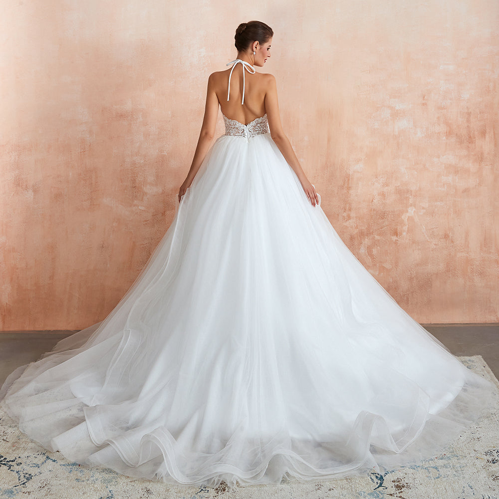 Vestido de novia largo de corte A con escote halter, espalda descubierta y apliques de tul