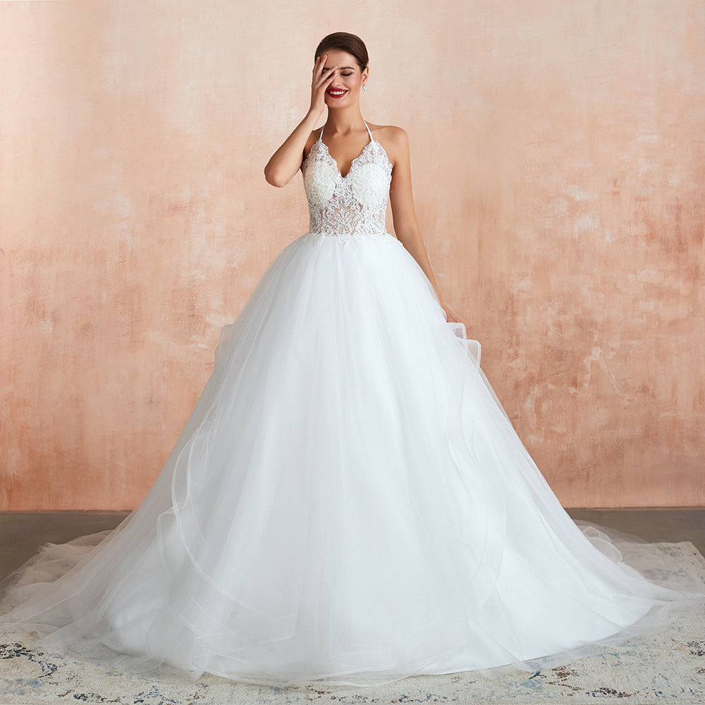 Vestido de novia largo de corte A con escote halter, espalda descubierta y apliques de tul