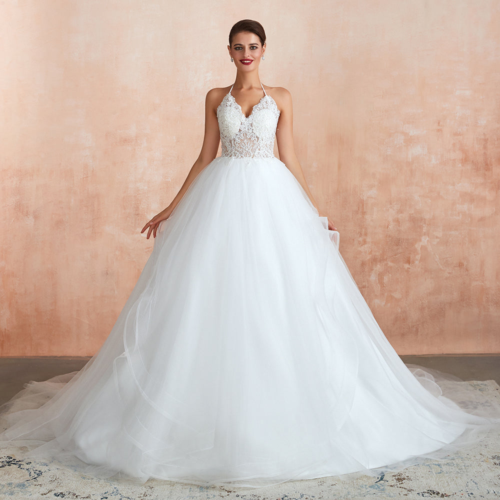 Vestido de novia largo de corte A con escote halter, espalda descubierta y apliques de tul