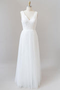 Vestido de novia largo de corte A, espalda descubierta, escote en V, encaje y tul