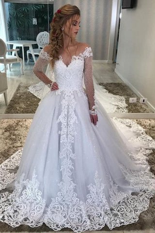 Vestido de novia largo de corte A, escote corazón, hombros descubiertos, apliques de encaje y lentejuelas, con mangas.