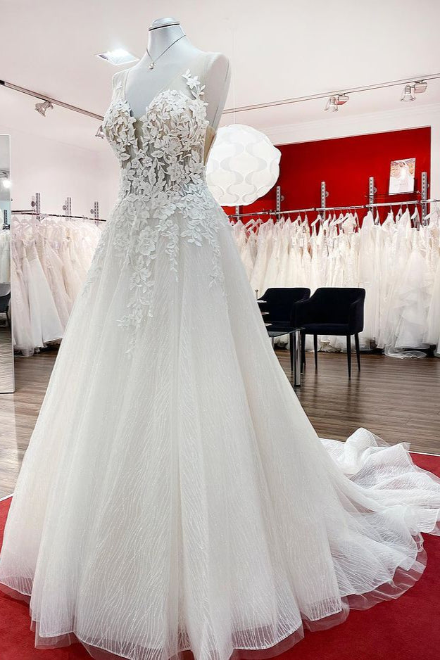 Vestido de novia largo de corte A, sin mangas, con volantes, joyas y aplicaciones de encaje.