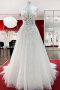 Vestido de novia largo de corte A, sin mangas, con volantes, joyas y aplicaciones de encaje.