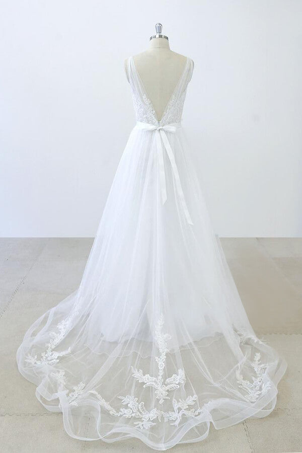 Robe de mariée longue en tulle dos nu, coupe trapèze, décolleté en V, bustier cœur, volants et appliques