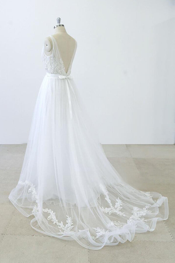 Robe de mariée longue en tulle dos nu, coupe trapèze, décolleté en V, bustier cœur, volants et appliques