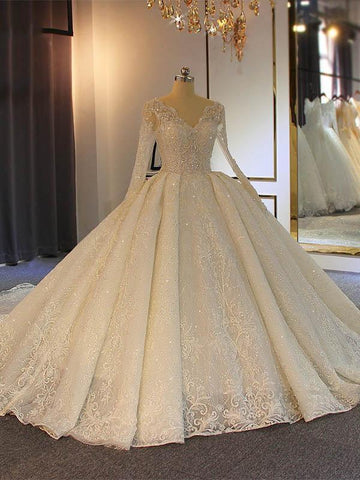 Vestidos de novia largos de corte princesa con encaje, escote en V brillante y mangas.