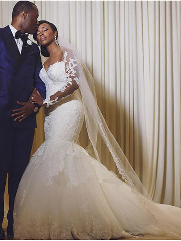 Vestidos de novia largos de organza con escote sirena, cola de corte y mangas, corte sirena y escote redondo.