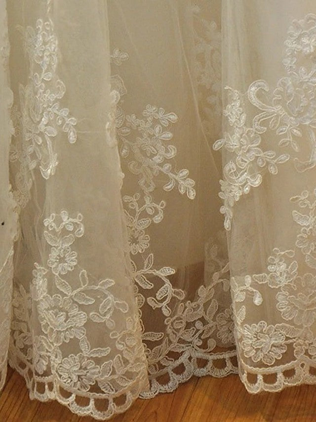 Vestidos de novia largos de sirena sin tirantes con cola de corte, de encaje y organza.