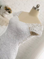 Vestidos de novia largos de sirena con escote en V, tul, encaje y espalda descubierta con mangas cortas.