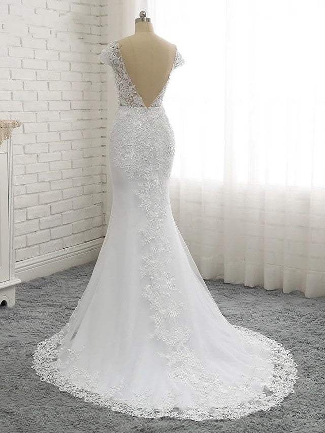 Vestidos de novia largos de sirena con escote en V, tul, encaje y espalda descubierta con mangas cortas.