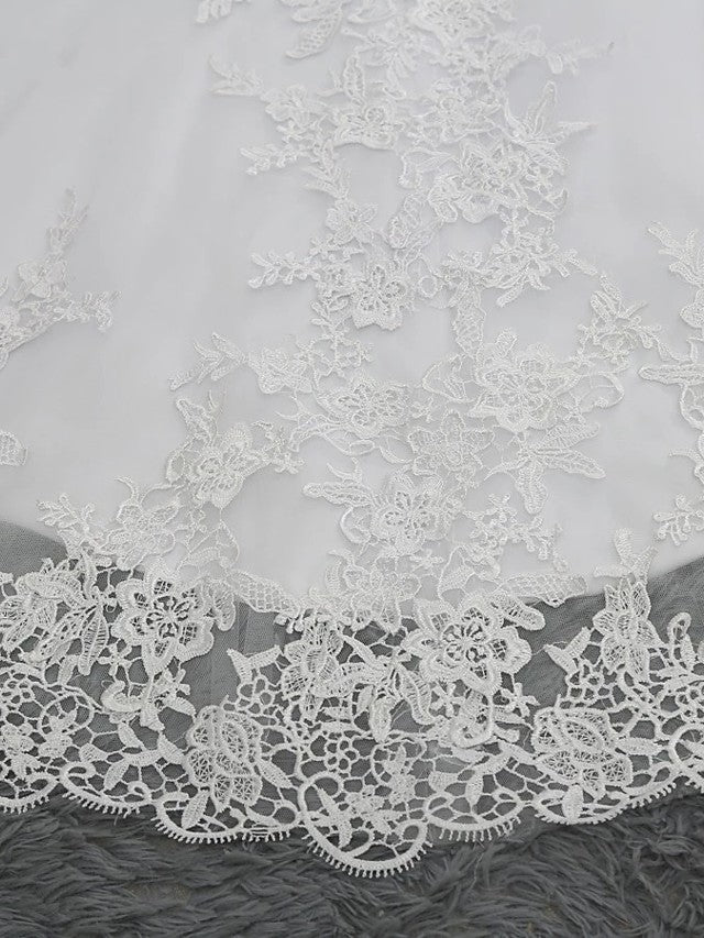 Vestidos de novia largos de sirena con escote en V, tul, encaje y espalda descubierta con mangas cortas.