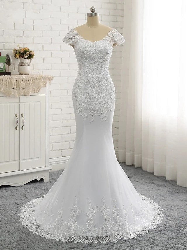 Vestidos de novia largos de sirena con escote en V, tul, encaje y espalda descubierta con mangas cortas.