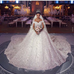 Robe de mariée longue princesse en dentelle à épaules dénudées