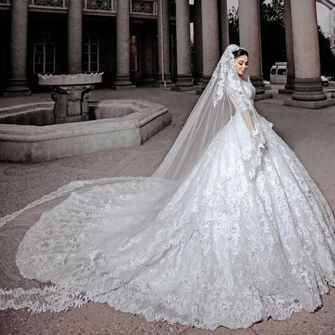 Vestido de novia largo de princesa con mangas, tul, cuentas, apliques de encaje y tul.