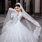 Vestido de novia largo de princesa con mangas, tul, cuentas, apliques de encaje y tul.