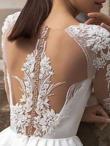 Vestidos de novia de satén de encaje, corte línea A, manga larga, cuello joya, cola de cepillo y bolsillos.