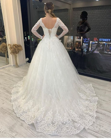 Vestido de novia de tul, corte en A, manga larga, escote en V, apliques de encaje y espalda descubierta