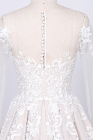 Vestido de novia de corte A con apliques de tul y manga larga 