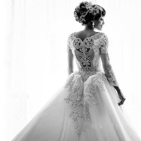 Vestidos de novia de sirena de manga larga con apliques de encaje y cuentas, con sobrefalda.