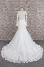 Robe de mariée sirène à manches longues, décolleté cœur, applications de dentelle et dos nu