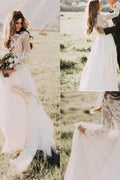 Robe de mariée en tulle à manches longues et décolleté décolleté orné d'appliqués