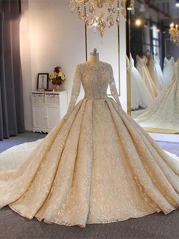 Vestidos de novia largos de lujo con encaje, pedrería y mangas, estilo princesa.