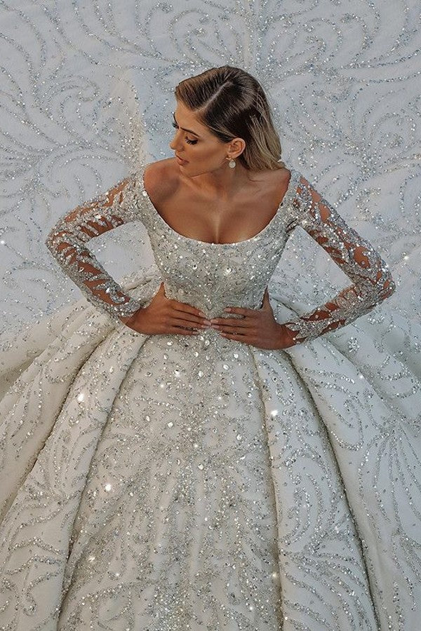 Vestido de novia largo de lujo con lentejuelas, hombros descubiertos, espalda descubierta y mangas.