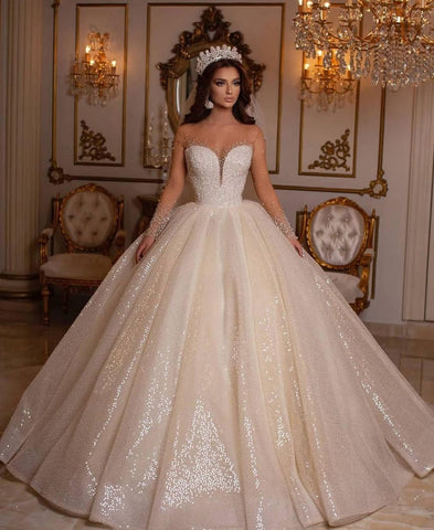 Vestido de novia largo de lujo con escote corazón, brillante y mangas, estilo princesa.