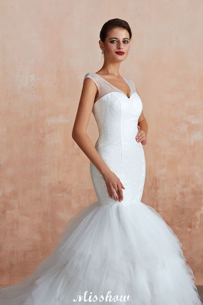 Robe de mariée blanche de luxe à col en V, manches courtes, laçage et sequins, idéale pour la plage.