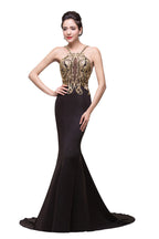 Robe de soirée noire sirène à bretelles spaghetti et longueur fleurie ornée de perles