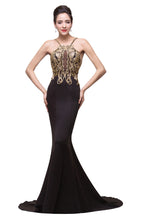 Robe de soirée noire sirène à bretelles spaghetti et longueur fleurie ornée de perles