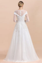 Vestido de novia sencillo con apliques de cuentas blancas, manga larga y largo hasta el suelo.