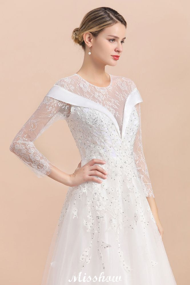 Vestido de novia sencillo con apliques de cuentas blancas, manga larga y largo hasta el suelo.