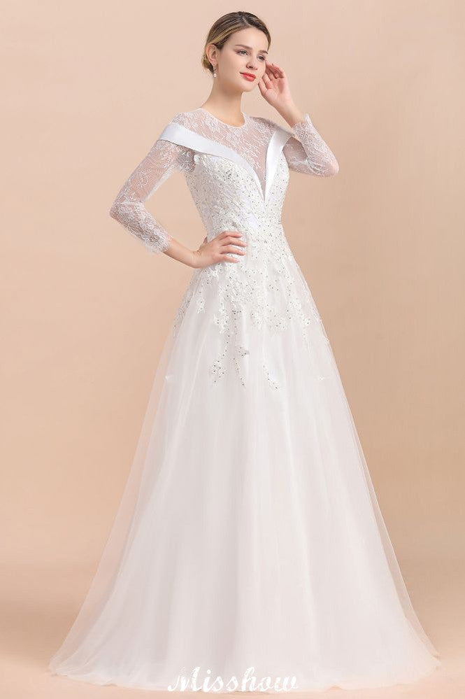 Vestido de novia sencillo con apliques de cuentas blancas, manga larga y largo hasta el suelo.