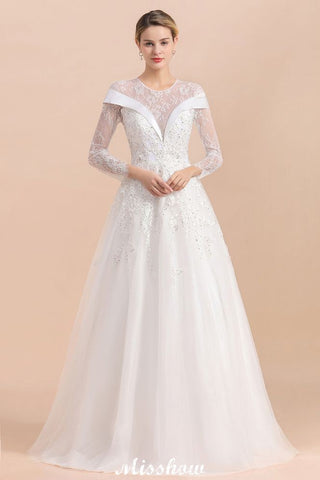 Vestido de novia sencillo con apliques de cuentas blancas, manga larga y largo hasta el suelo.