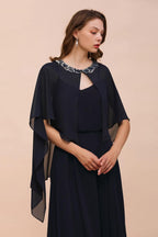 Robe de demoiselle d'honneur bleu marine avec perles et drapé, longueur au sol, en mousseline.