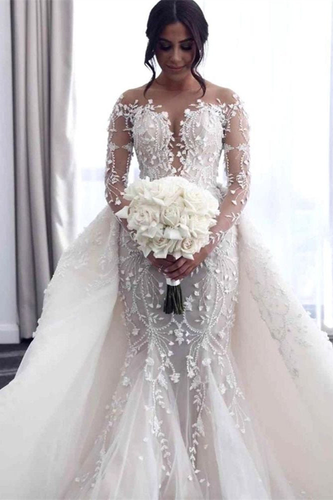 Robe de mariée à épaules dénudées et décolleté en V profond avec surjupe